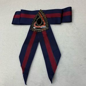 Blue and red brooch